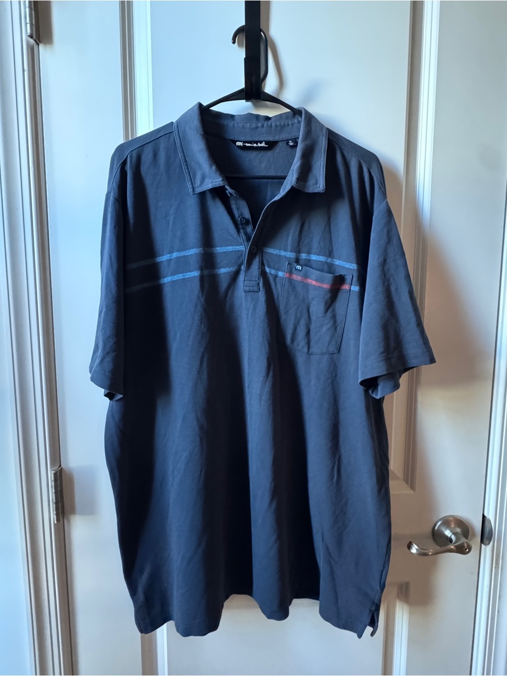 Travis Mathew Dark Navy Polo with Subtle Stripe and Pocket